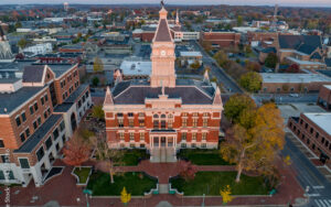 Aerial view of Clarksville, Tennessee courthouse and surrounding cityscape, captured at sunset for Bliss Products and Services.
