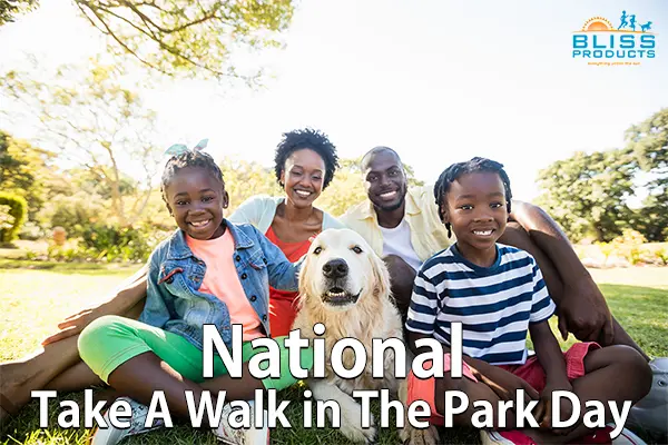 family group with dog sitting in park
