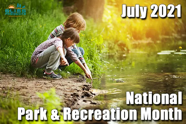 boy and girl crouched over stream and pointing into water