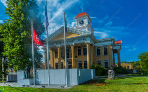 Blount County Courthouse in Maryville, Tennessee, with American and Tennessee flags, representing a community served by Bliss Products and Services.