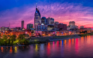 Colorful sunset view of downtown Nashville skyline reflecting on the Cumberland River, symbolizing vibrant Tennessee communities served by Bliss Products and Services