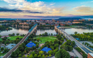 Aerial view of Chattanooga skyline and Tennessee River near downtown parks — representative of community spaces supported by Bliss Products and Services