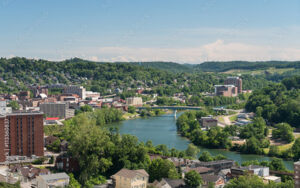 Aerial view of Morgantown, West Virginia, in Monongalia County, showing the Monongahela River, showcasing Bliss Products and Services commitment to enhancing public spaces.