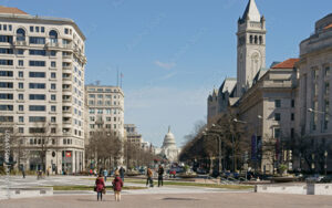 Northwest Washington DC streetscape featuring the U.S. Capitol and Old Post Office, showcasing civic architecture near Pennsylvania Avenue — Bliss Products and Services regional project area.