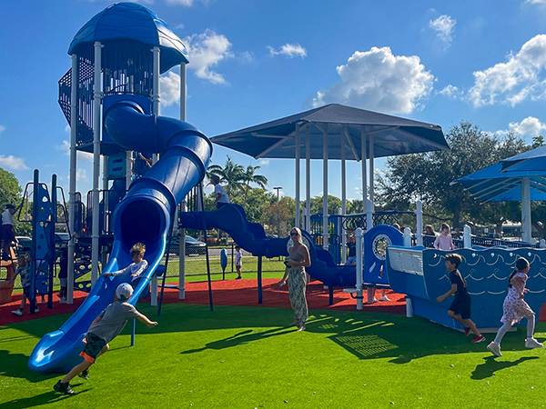 Fleischmann Park Playground – Naples, FL | Bliss Products and Services Playground and shade structure installation at Fleischmann Park in Naples, Florida by Bliss Products and Services