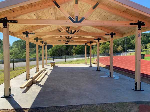 Wooden covered bridge under construction at Chesapeake City Hall, Virginia, designed by Bliss Products and Services