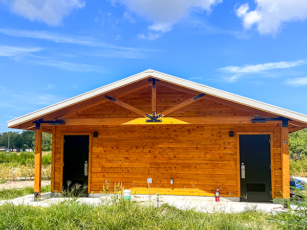 Restroom facility with timber truss design at Gov. Ron DeSantis Park in Florida – Bliss Products and Services