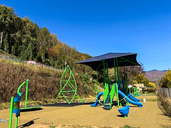 Sylva Bryson Park Playground – Bliss Products and Services Inclusive playground with shade structures at Sylva Bryson Park in Western North Carolina, designed and installed by Bliss Products and Services