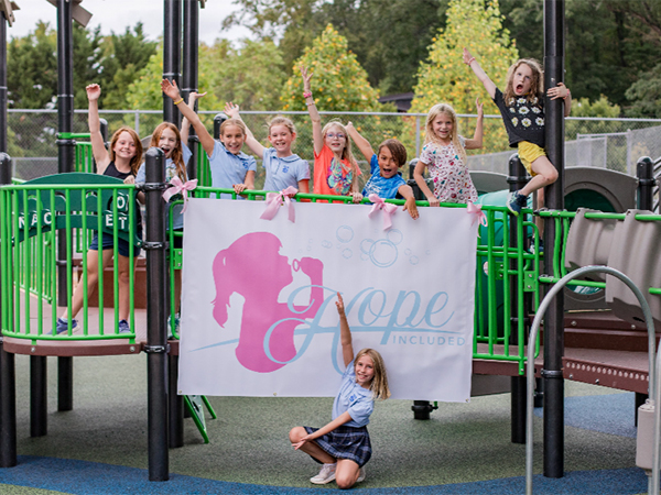 Hope Included banner displayed at the opening of Riverview Park’s inclusive playground in Chattanooga, Tennessee, installed by Bliss Products and Services.
