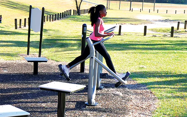 actionfit-cardio-walker-glider-user-in-motion Child spinning in an orange bowl spinner on unitary surfacing, available from Bliss Products and Services.
