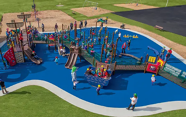 Aerial view of an inclusive playground with ramps, sensory panels, and poured-in-place surfacing, available from Bliss Products and Services in Franklin County, TN