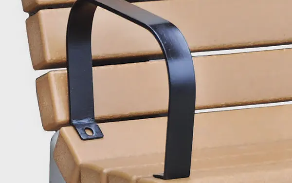 Close-up of black armrest bracket on park bench slats.