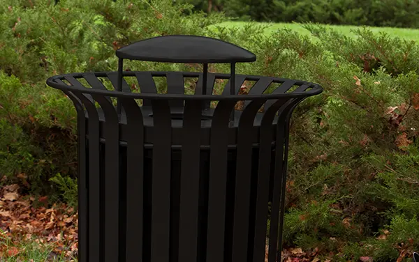 Decorative Trash Receptacle with Hood | Bliss Products & Services Black slatted trash receptacle with domed lid in landscaped area — Bliss Products & Services