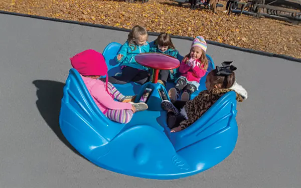 Inclusive ground-level whirl spinner with center table in Barbour County, Alabama, available from Bliss Products and Services.
