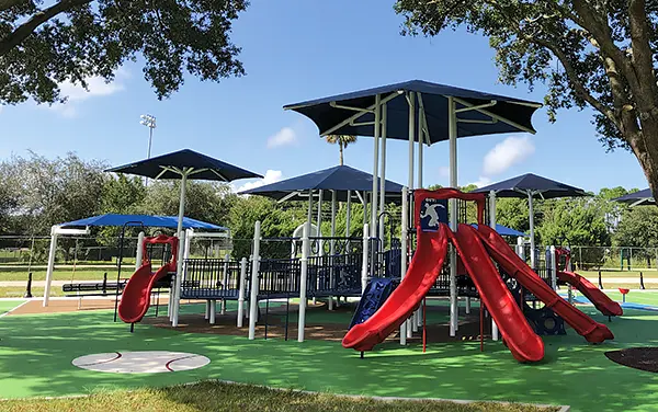 Two large umbrella engineered shade over a playground in Lafayette County, FL