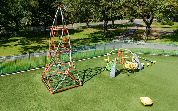 Cable net pyramid tower climber on synthetic turf, available from Bliss Products and Services.