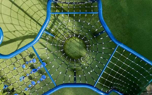Overhead view of a funnel net climber on synthetic turf,.