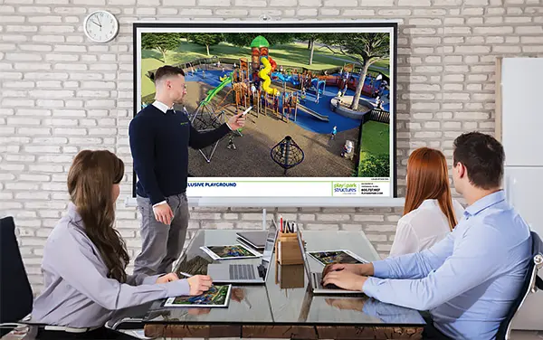 Stakeholder presentation with a large screen 3D playground visualization, available from Bliss Products and Services.