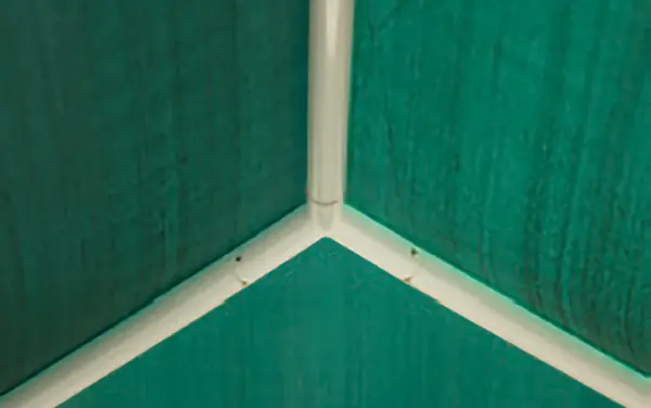 Shade fabric corner seam and cable pocket detail.