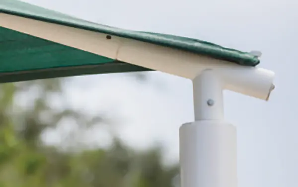 Quick-release elbow corner and fabric attachment detail on a shade frame.