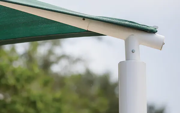 Quick-release elbow and corner connection detail on a shade structure.