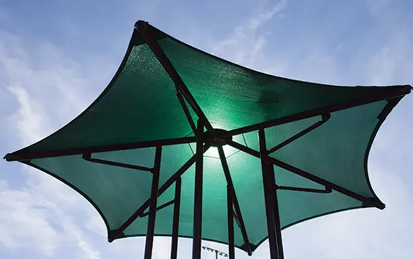 Underside view of a single-post hexagon umbrella shade structure in Spring Hill Alabama,
Escambia County