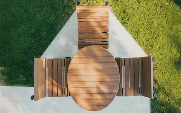 Outdoor classroom deck with curved bench seating viewed from above, used for the Brownsville, Florida card by Bliss Products and Services.