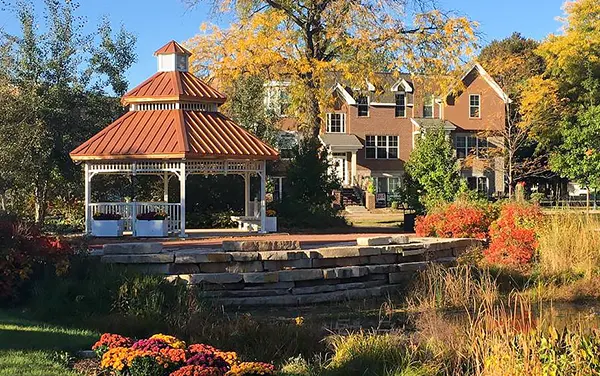 Victorian gazebo with copper roof near a pond in Conecuh County, Alabama, available from Bliss Products and Services.