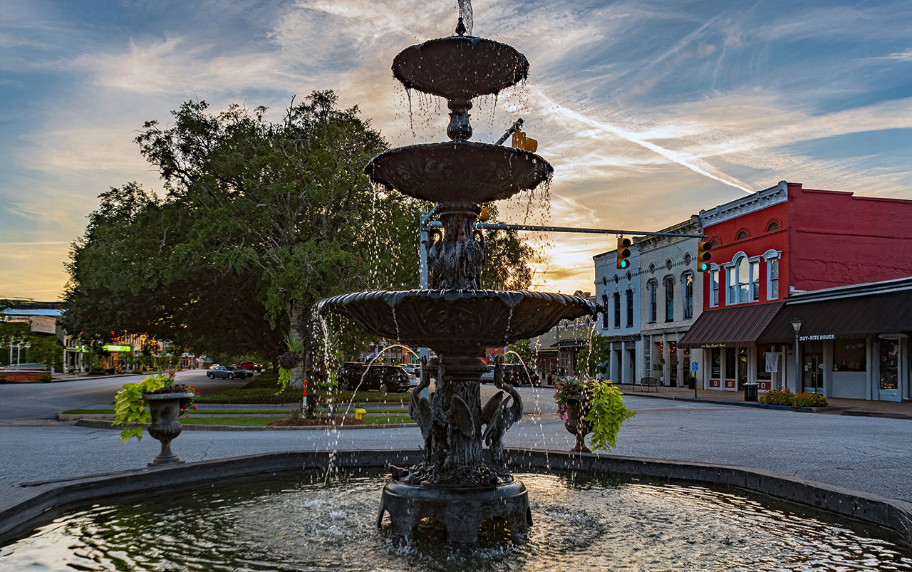 Colorful sunset view of downtown Nashville skyline reflecting on the Cumberland River, symbolizing vibrant Tennessee communities served by Bliss Products and Services