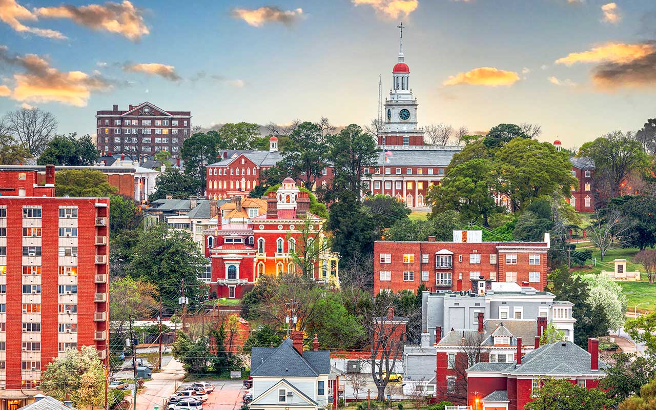 Colorful sunset view of downtown Nashville skyline reflecting on the Cumberland River, symbolizing vibrant Tennessee communities served by Bliss Products and Services