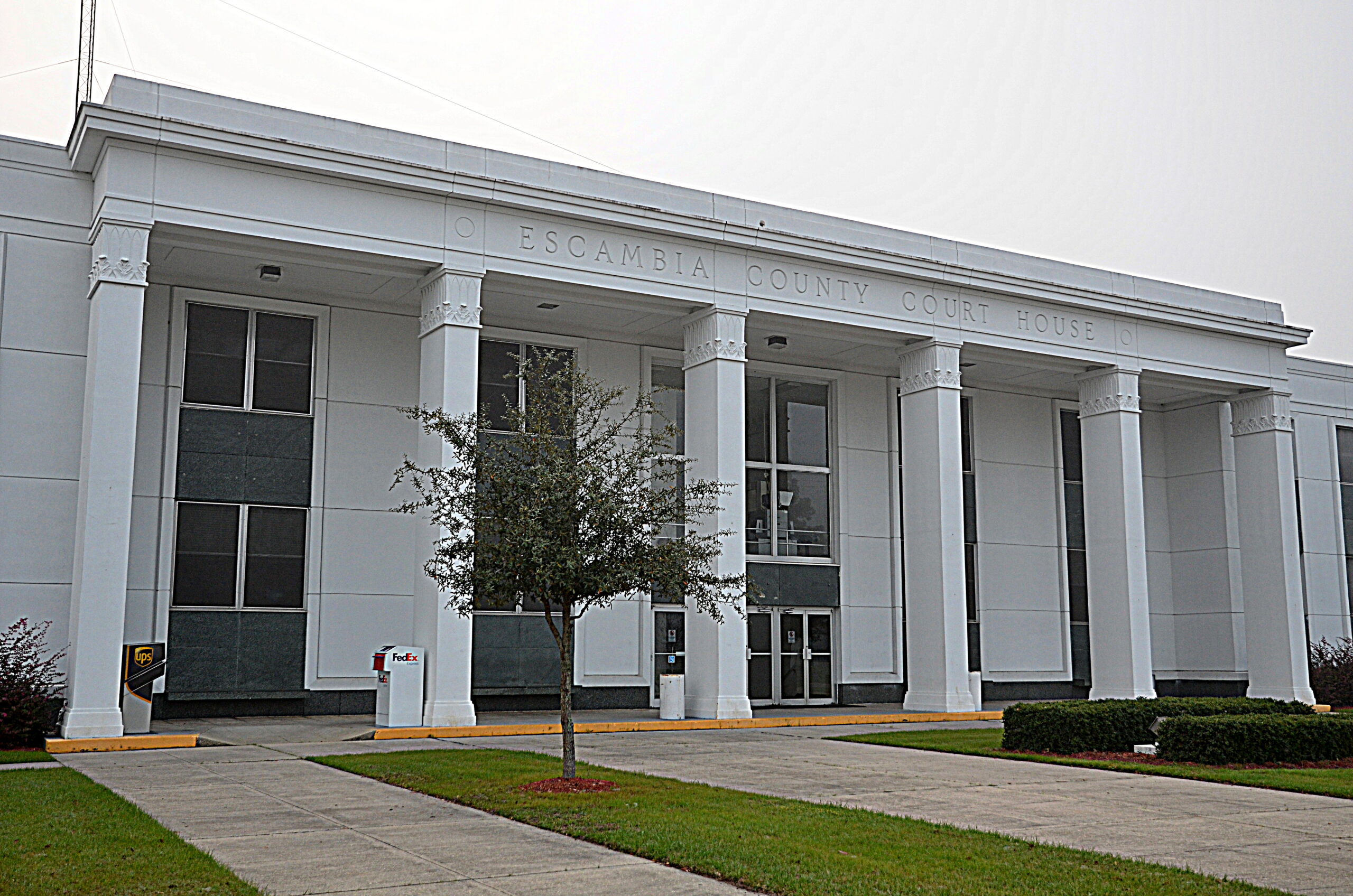 Escambia County Courthouse in Brewton, Alabama, white facade with columns. Used by Bliss Products and Services.