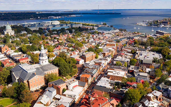 Aerial of Annapolis with the Maryland State House, U.S. Naval Academy, and the Severn River for Reggie Johnson’s Maryland and Delaware page with Bliss Products and Services.