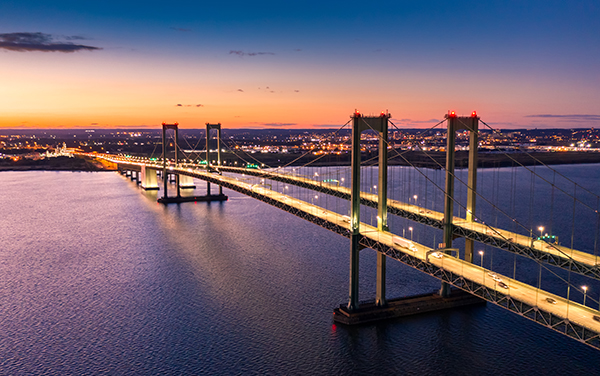 Delaware Memorial Bridge at dusk over the Delaware River, for Reggie Johnson’s Maryland and Delaware page with Bliss Products and Services.