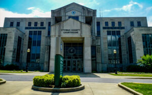 Etowah County Courthouse in Gadsden, Alabama, with glass panels and central entry. Used by Bliss Products and Services.