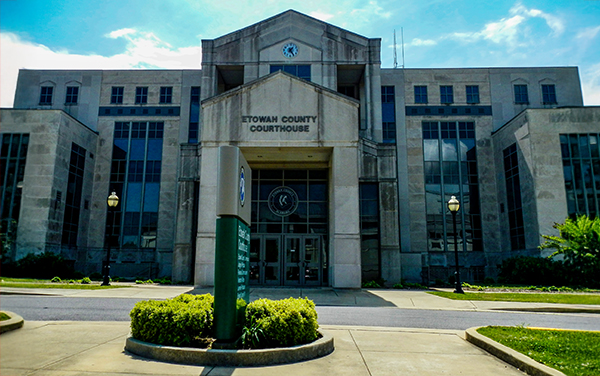 Etowah County Courthouse in Gadsden, Alabama, with glass panels and central entry. Used by Bliss Products and Services.