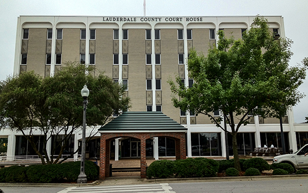 Lauderdale County Courthouse in Florence, Alabama, with arched entry pavilion and trees. Used by Bliss Products and Services.