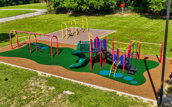 magnum-4 Player reaches under the basket for a reverse layup