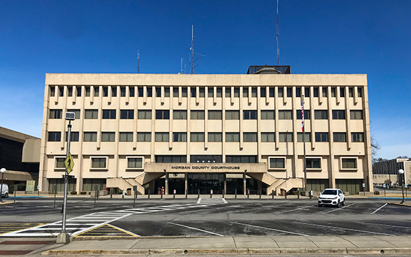 Morgan County Courthouse in Decatur, Alabama, modern beige facade with central entrance canopy. Used by Bliss Products and Services.