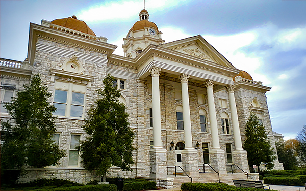 Shelby County Courthouse in Alabama with stone façade and columns, for Bliss Products and Services.