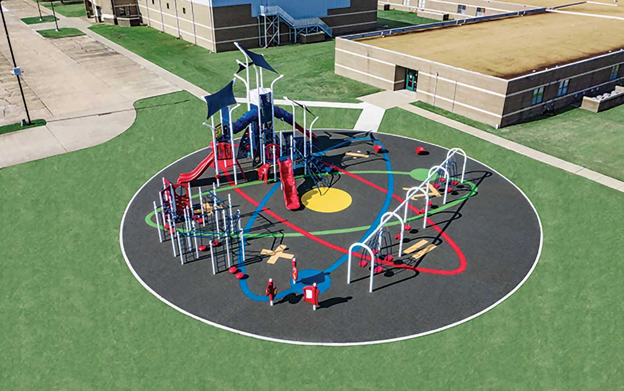 STEM-Themed Playground with Shade STEM-themed playground with circular surfacing graphics and shade sails.