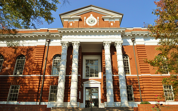 Talladega County Courthouse in Talladega, Alabama, with brick exterior and white columns, for Bliss Products and Services.