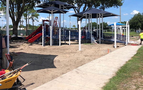 Stakeholder presentation with a large screen 3D playground visualization, available from Bliss Products and Services.