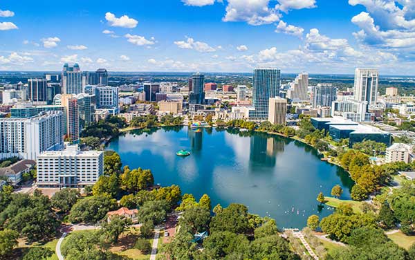 Downtown Orlando Skyline over Lake Eola, Florida Downtown Orlando skyline over Lake Eola, Florida, aerial view. Bliss Products and Services.