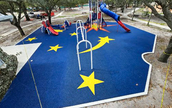 Custom star themed poured in place rubber playground surfacing at Scott Park in Miami Gardens, Florida, provided by Bliss Products and Services.
