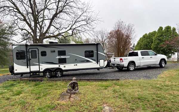 trailer-and-truck-1-2025 Ribbon-cutting event at Leon County Dog Park in Tallahassee, Florida, featuring Bliss Products and Services project led by Ron Harley.