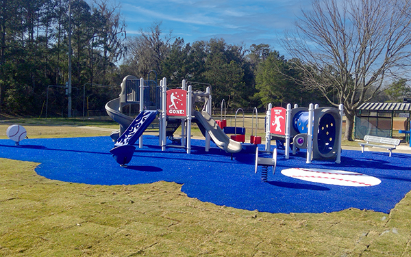 Blue Poured In Place Safety Surfacing for Canopy Oaks Park Georgia Playground Blue poured in place safety surfacing around a baseball themed playground in Canopy Oaks Park, Georgia installed by Bliss Products and Services