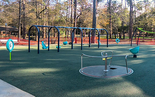 Fullwood Park Georgia Inclusive Swings and Accessible Spinner Inclusive swings and accessible spinner on poured in place safety surfacing at Fullwood Park in Georgia installed by Bliss Products and Services
