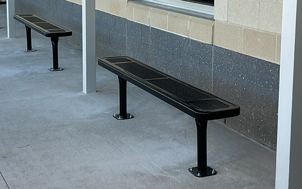 Nims Middle School Bus Route Benches Surface mounted steel benches along the covered bus route walkway at Nims Middle School supplied by Bliss Products and Services
