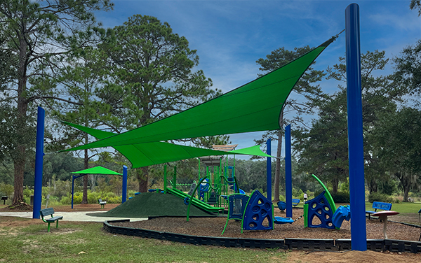 Pedrick Park Georgia Playground Shade Sails Green shade sails over a playground at Pedrick Park in Georgia installed by Bliss Products and Services