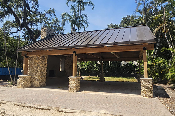 Ben Butler Rock House Pavilion at Charles F. Vollman Park in Hollywood, Florida, rebuilt open-air pavilion with preserved coral rock chimney. Bliss Products and Services.